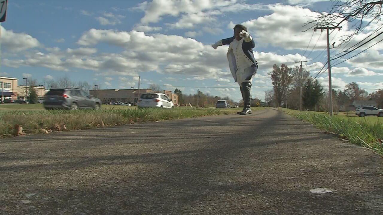 Performing 'Hamilton' hits, Male High School grad turns street into stage